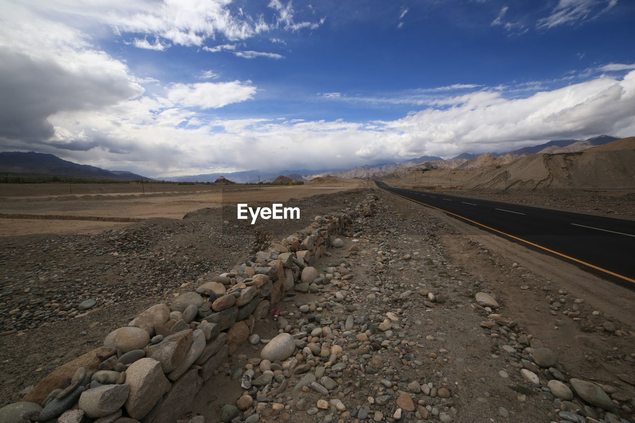 SURFACE LEVEL OF RAILROAD TRACK ALONG LANDSCAPE