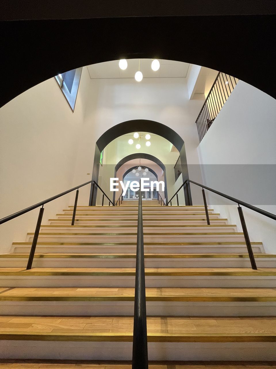 LOW ANGLE VIEW OF ILLUMINATED STEPS IN BUILDING