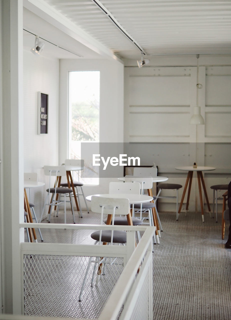 Empty chairs and table in restaurant