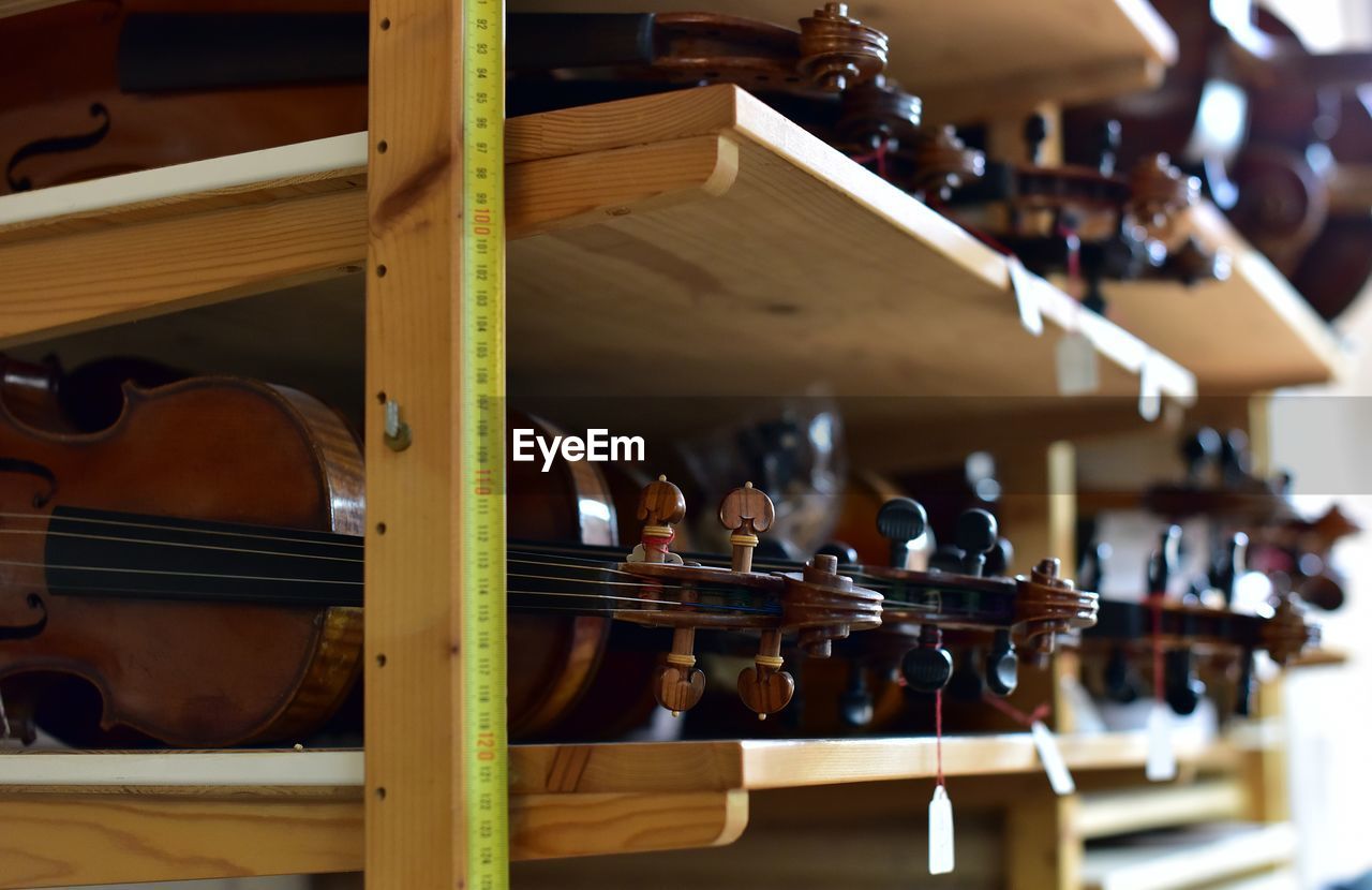 Close-up of violins for sale at store