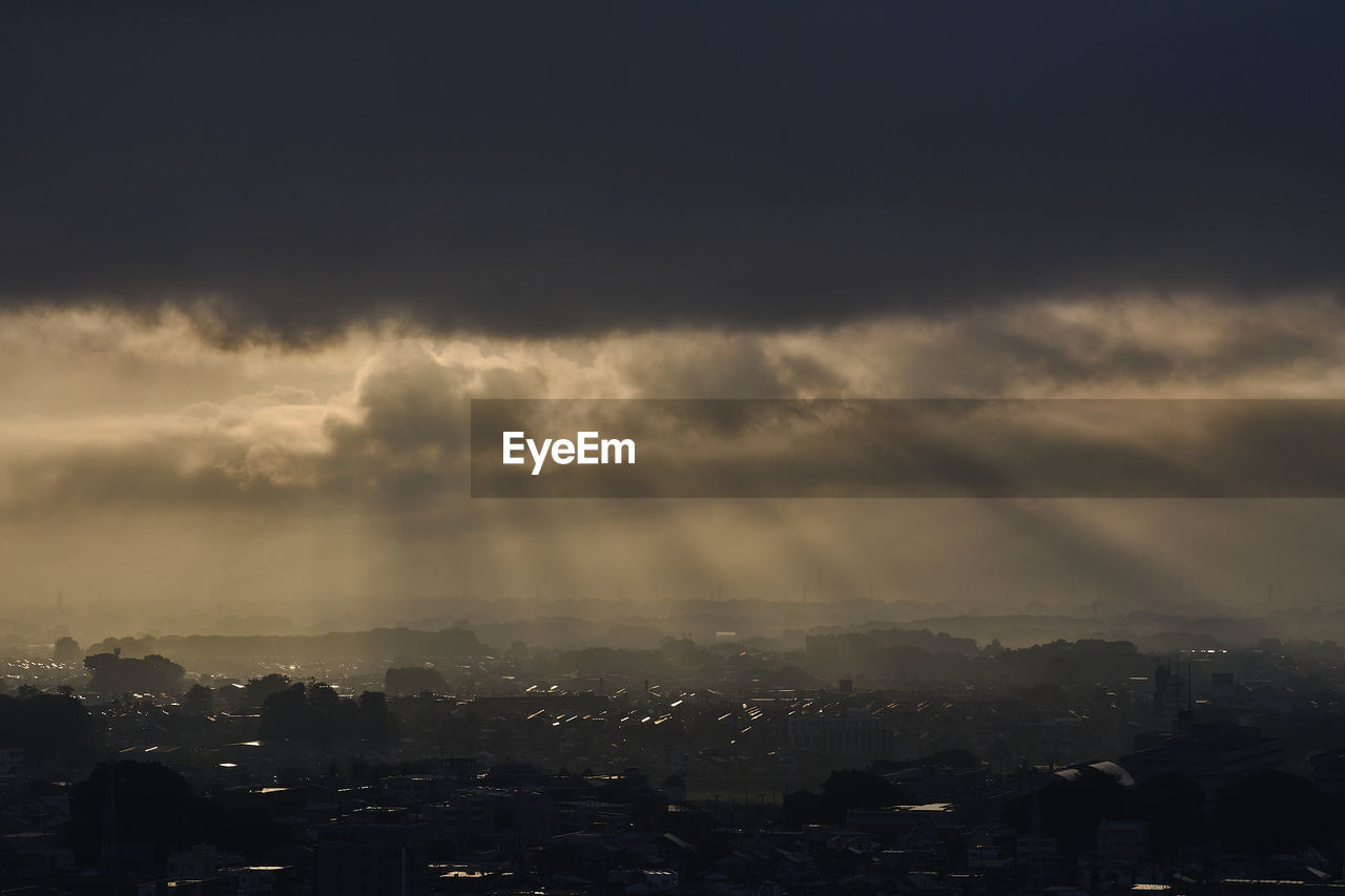 High angle view of townscape against sky at sunrise 