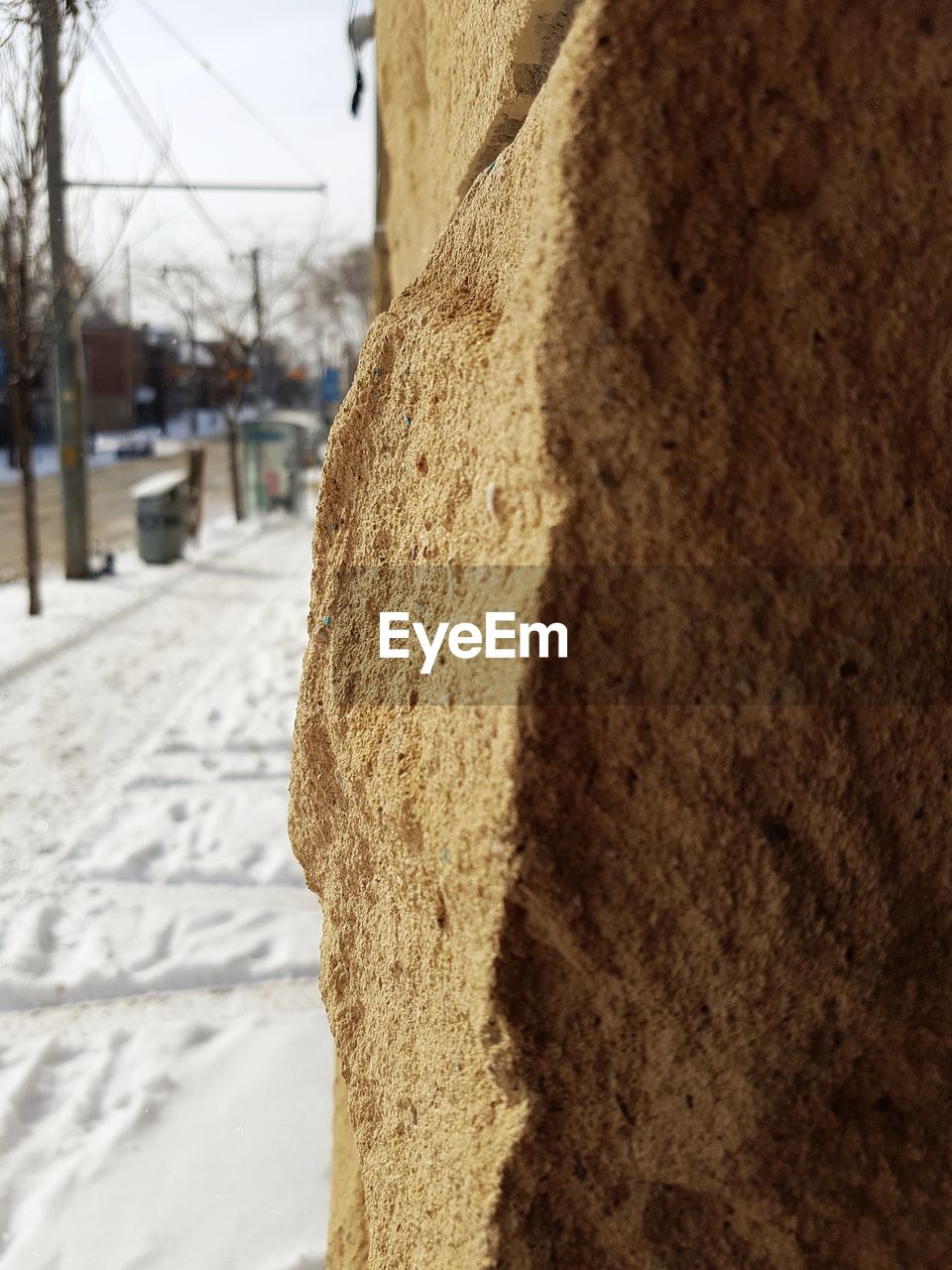 CLOSE-UP OF SNOW ON BUILDING