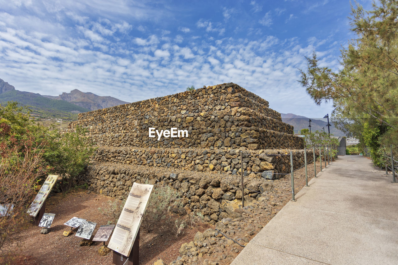 architecture, sky, nature, ruins, ancient history, plant, history, no people, tree, built structure, ancient, cloud, the past, archaeological site, landscape, rock, travel destinations, outdoors, day, travel, environment, wall, monument, scenics - nature, mountain, stone material, land