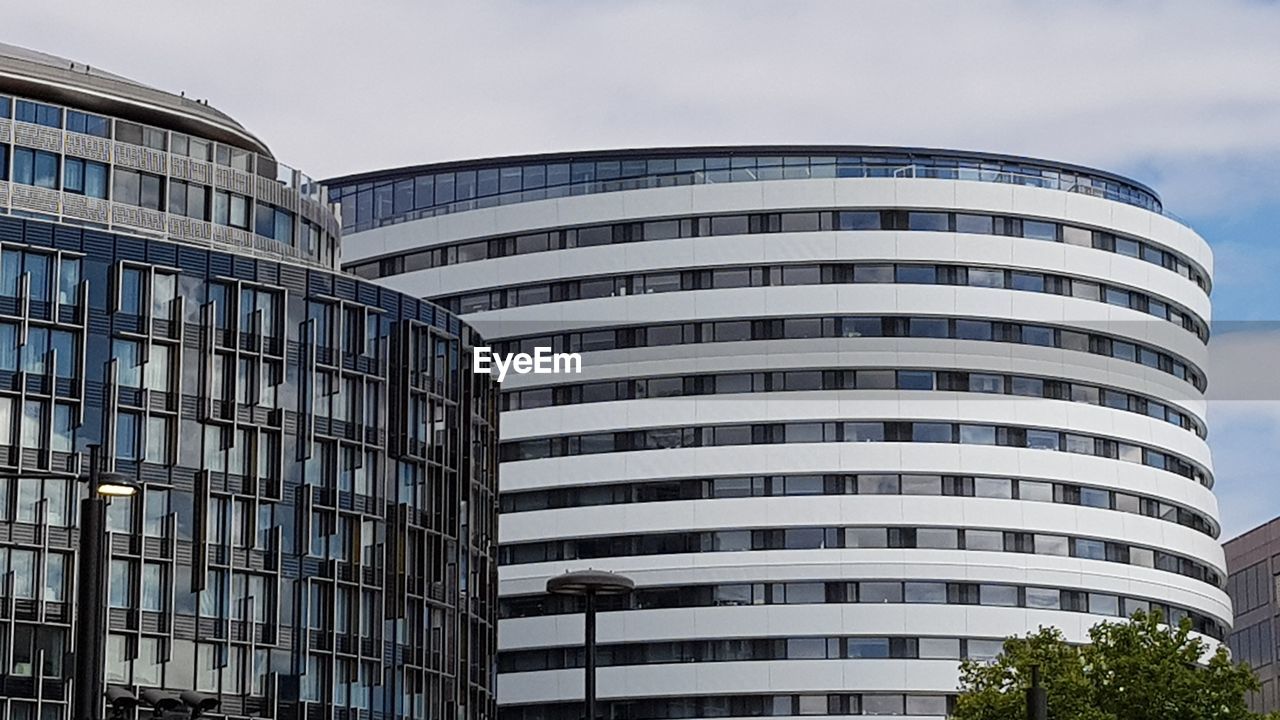 Low angle view of office building against sky