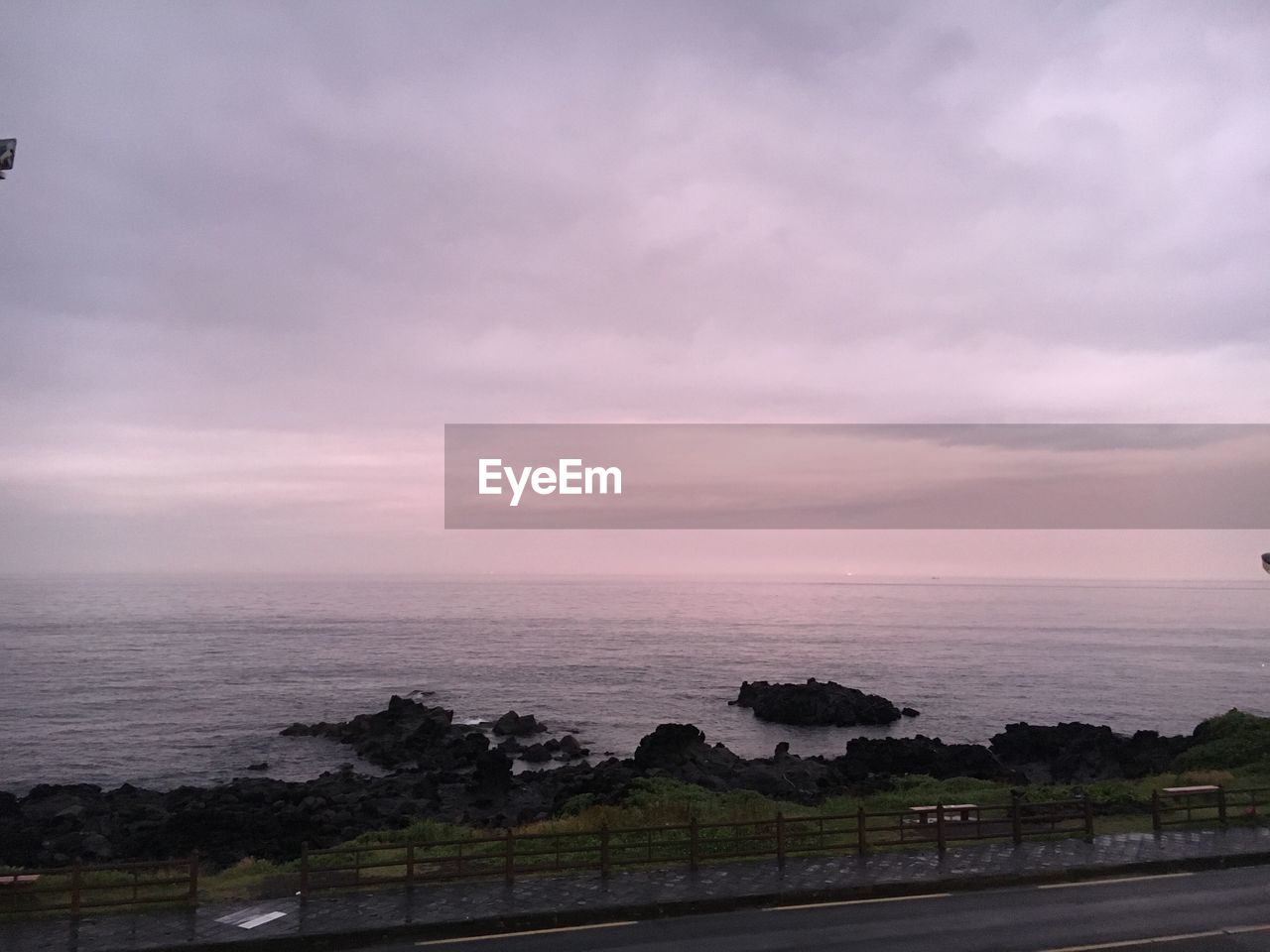 VIEW OF SEA AGAINST CLOUDY SKY