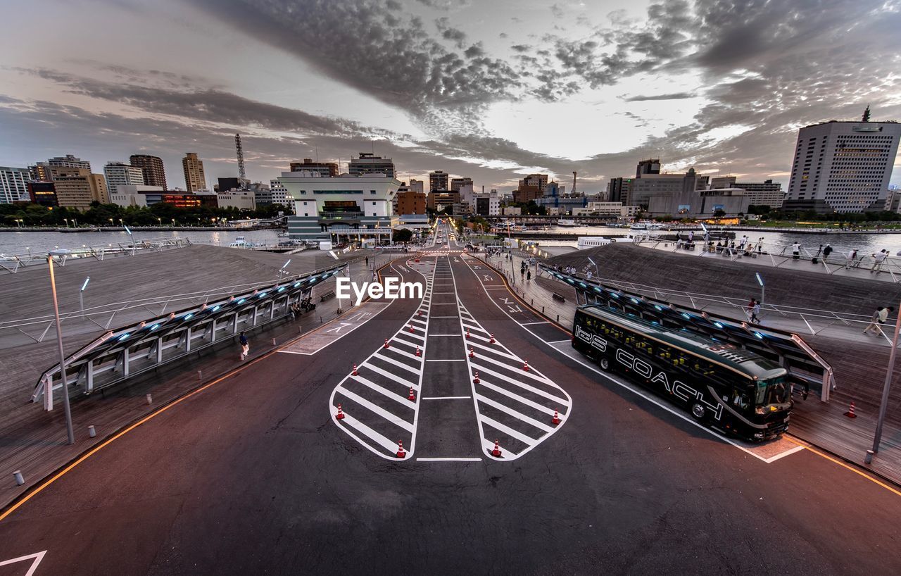 High angle view of city street against sky during sunset