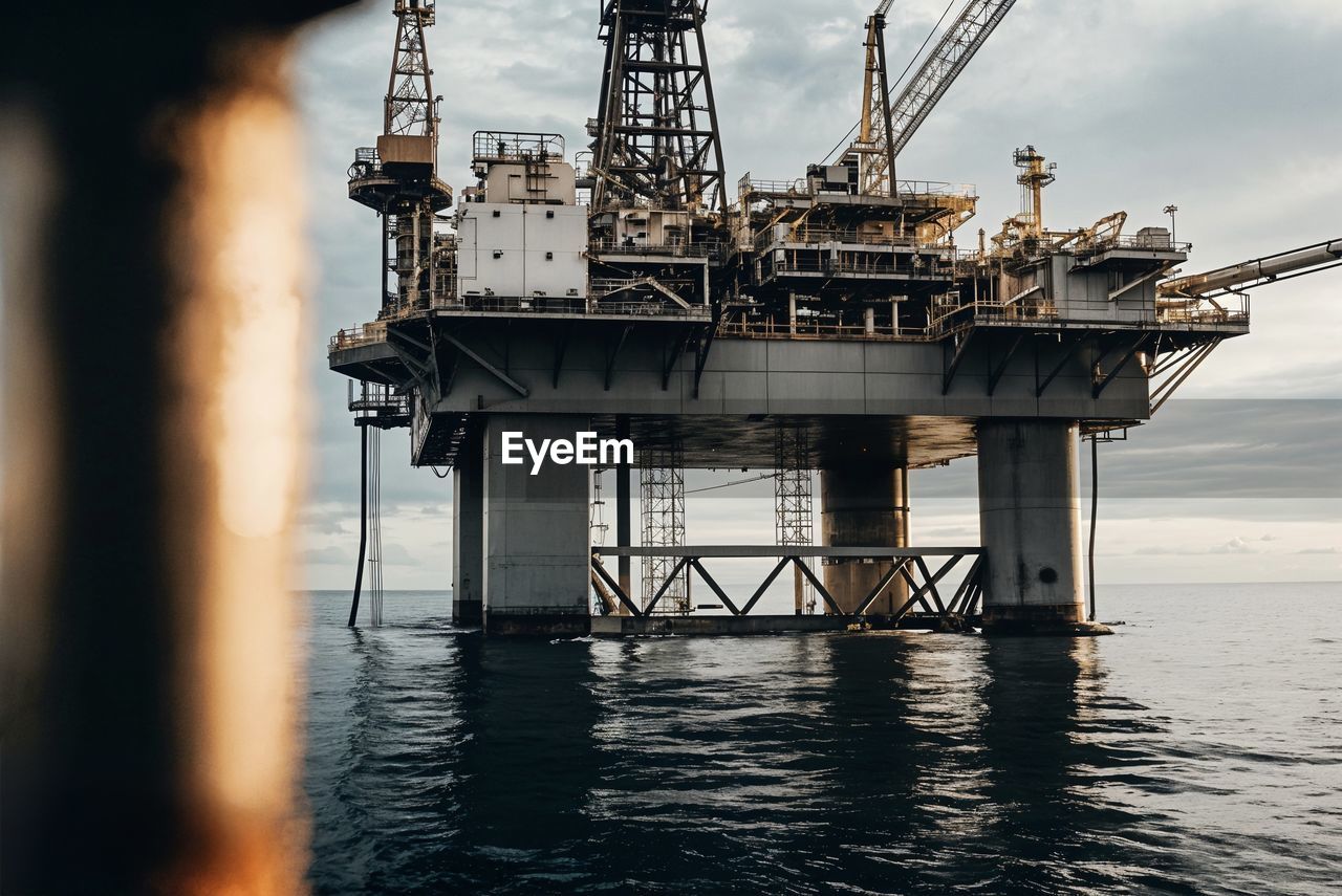 Offshore oil rig at sunset over the ocean. high quality photo
