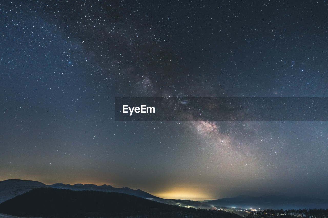 Scenic view of star field against sky at night