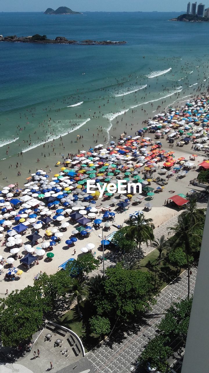 HIGH ANGLE VIEW OF BEACH BY SEA