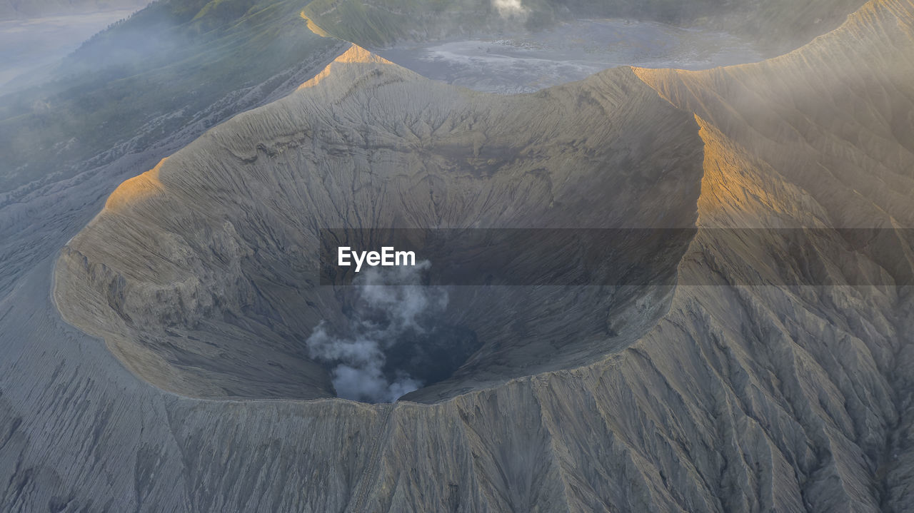 volcano, landscape, geology, volcanic crater, environment, land, beauty in nature, nature, mountain, no people, volcanic landscape, scenics - nature, non-urban scene, physical geography, smoke, power in nature, day, outdoors, high angle view, active volcano, erupting, lava dome, travel destinations