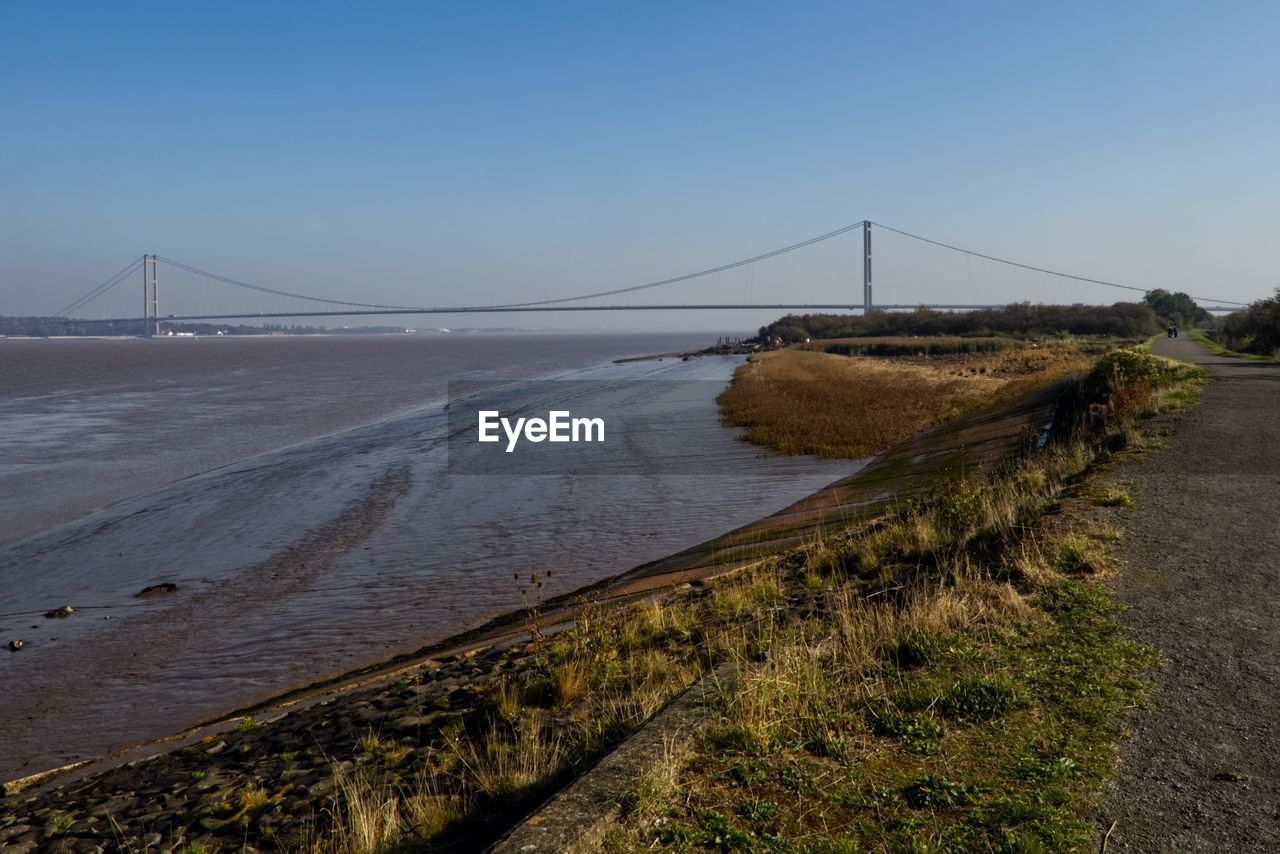 View of suspension bridge over sea