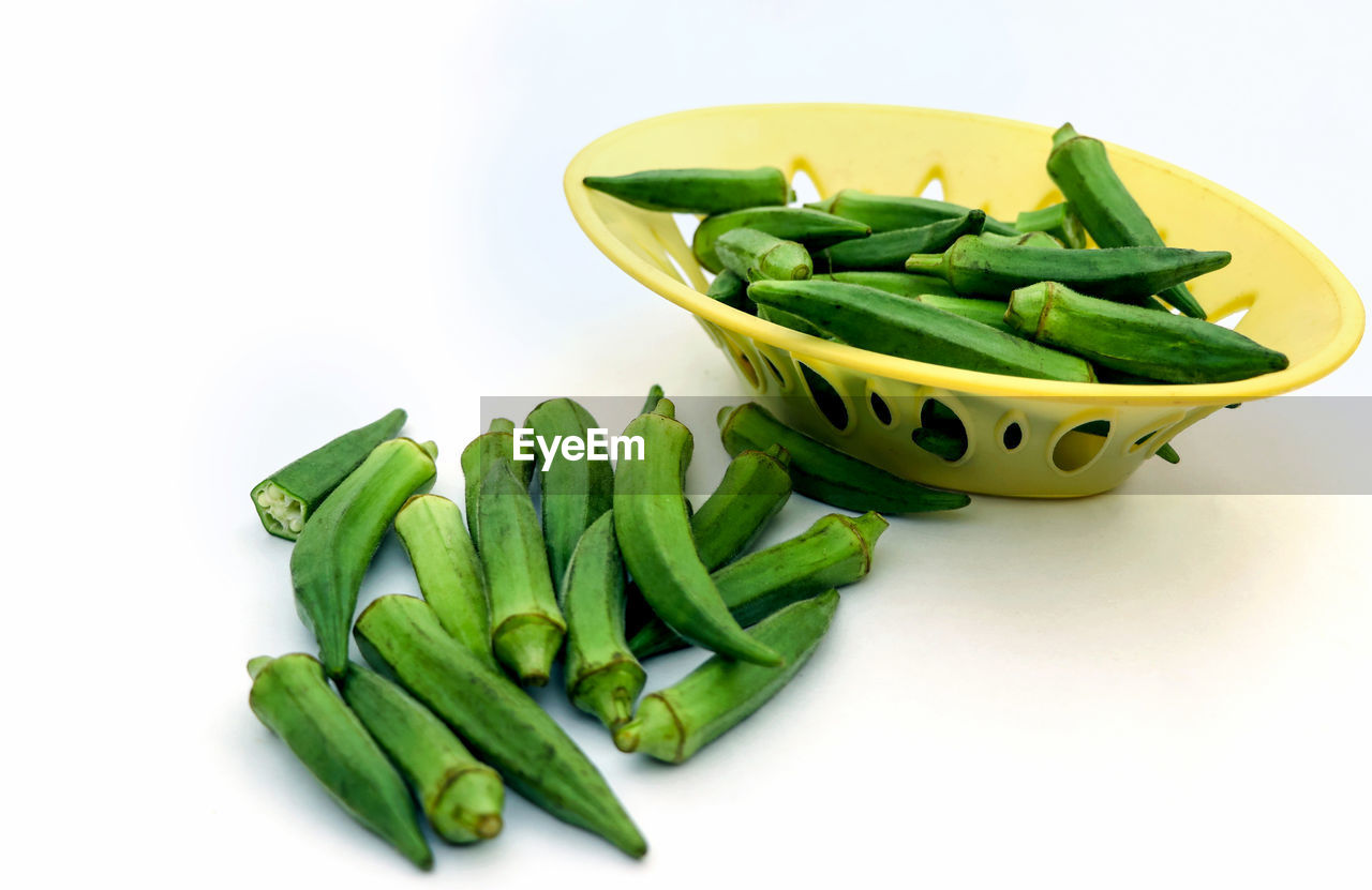 HIGH ANGLE VIEW OF VEGETABLES ON GREEN BACKGROUND