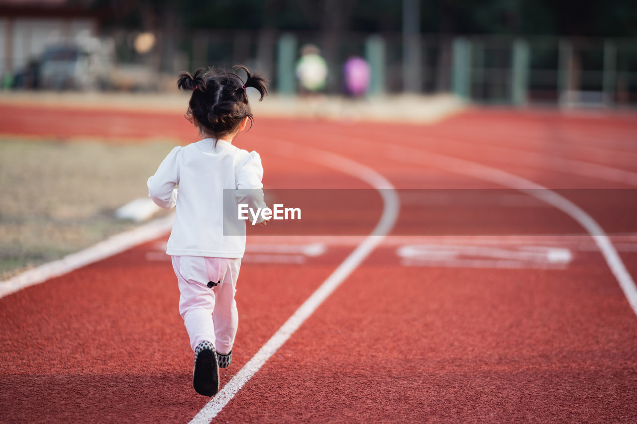 Rear view of boy running