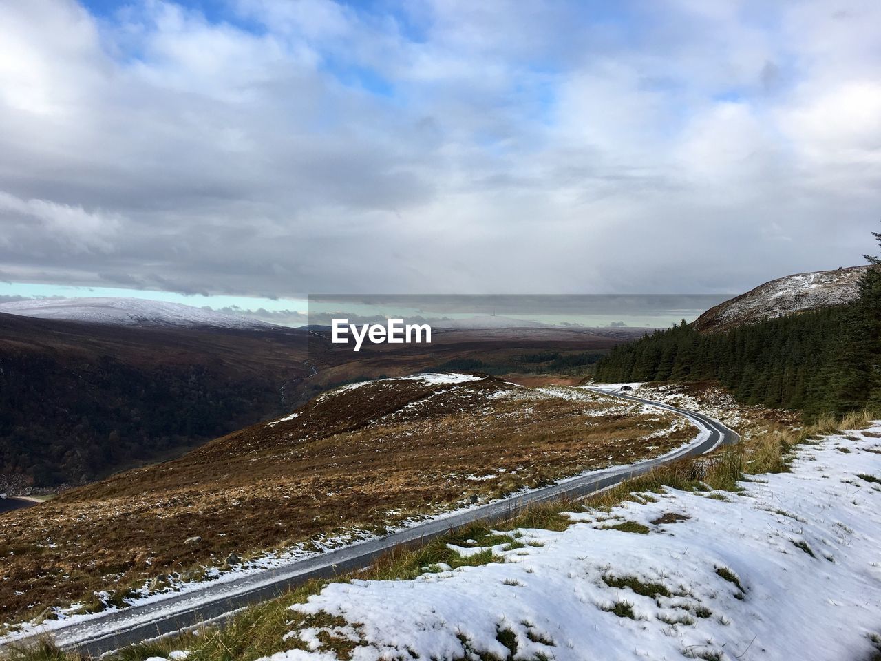 Scenic view of landscape against sky during winter