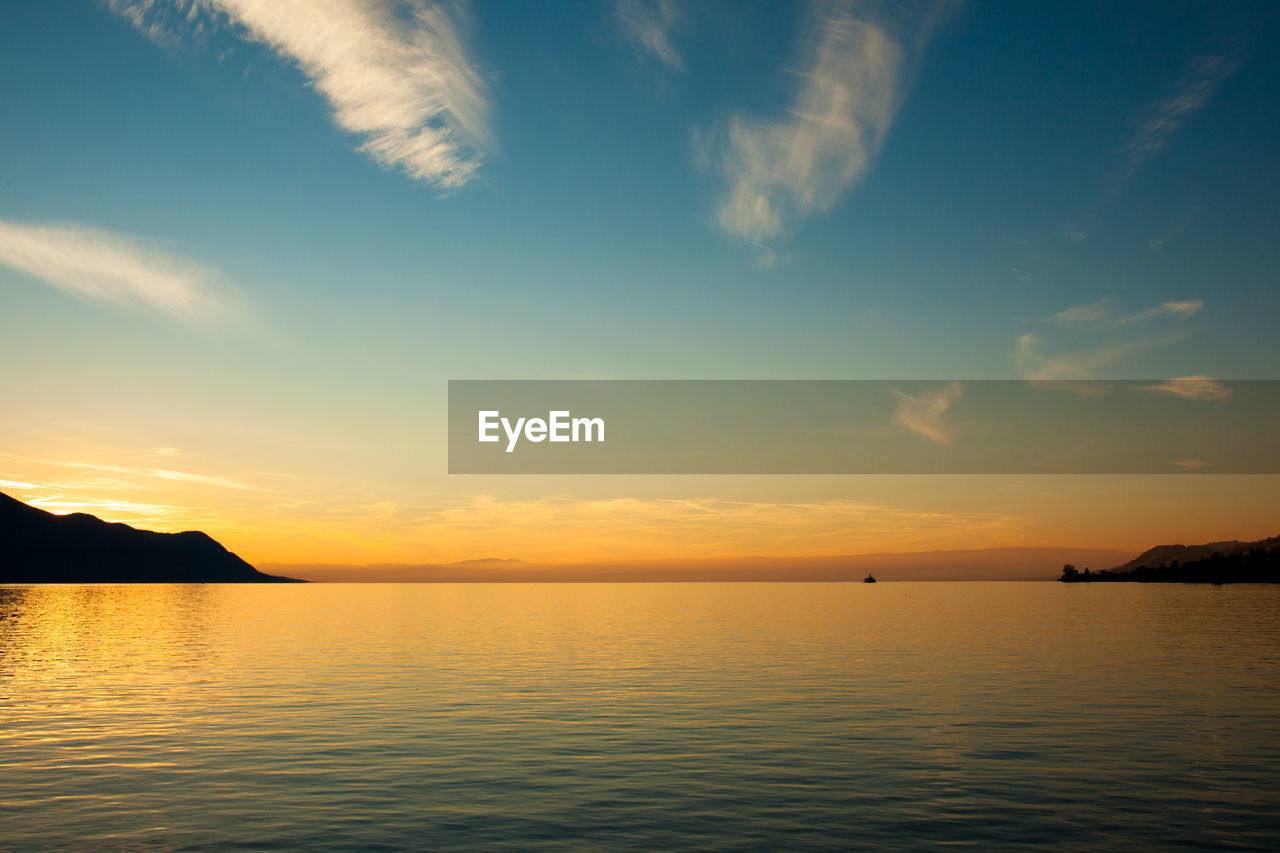 SCENIC VIEW OF SEA DURING SUNSET