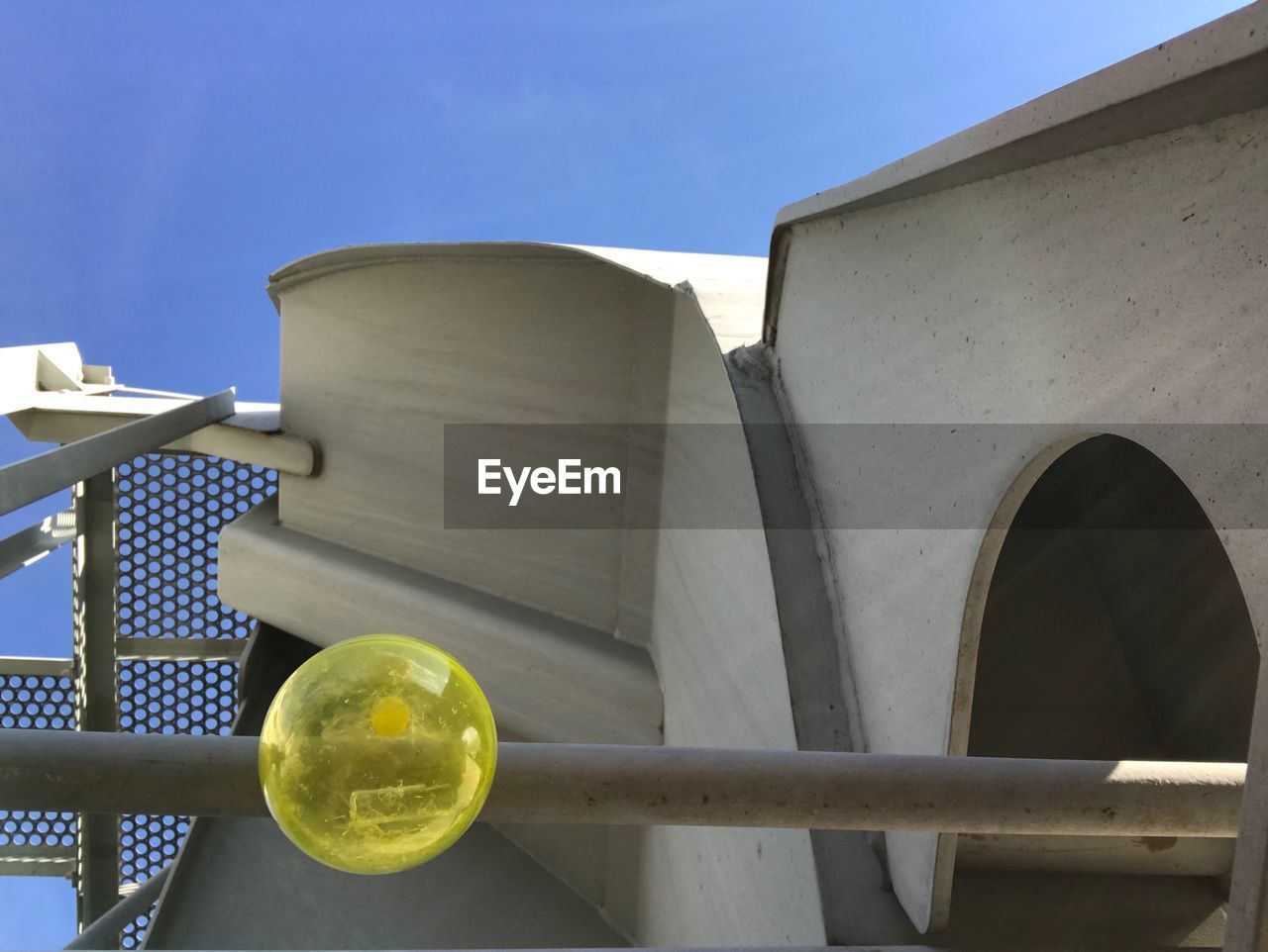 LOW ANGLE VIEW OF METALLIC STRUCTURE AGAINST SKY