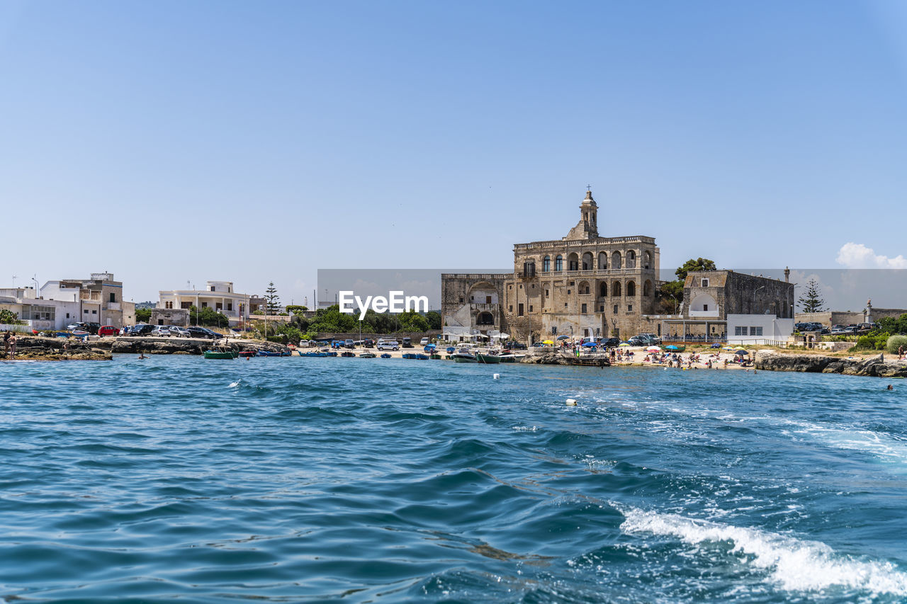 VIEW OF BUILDINGS BY SEA