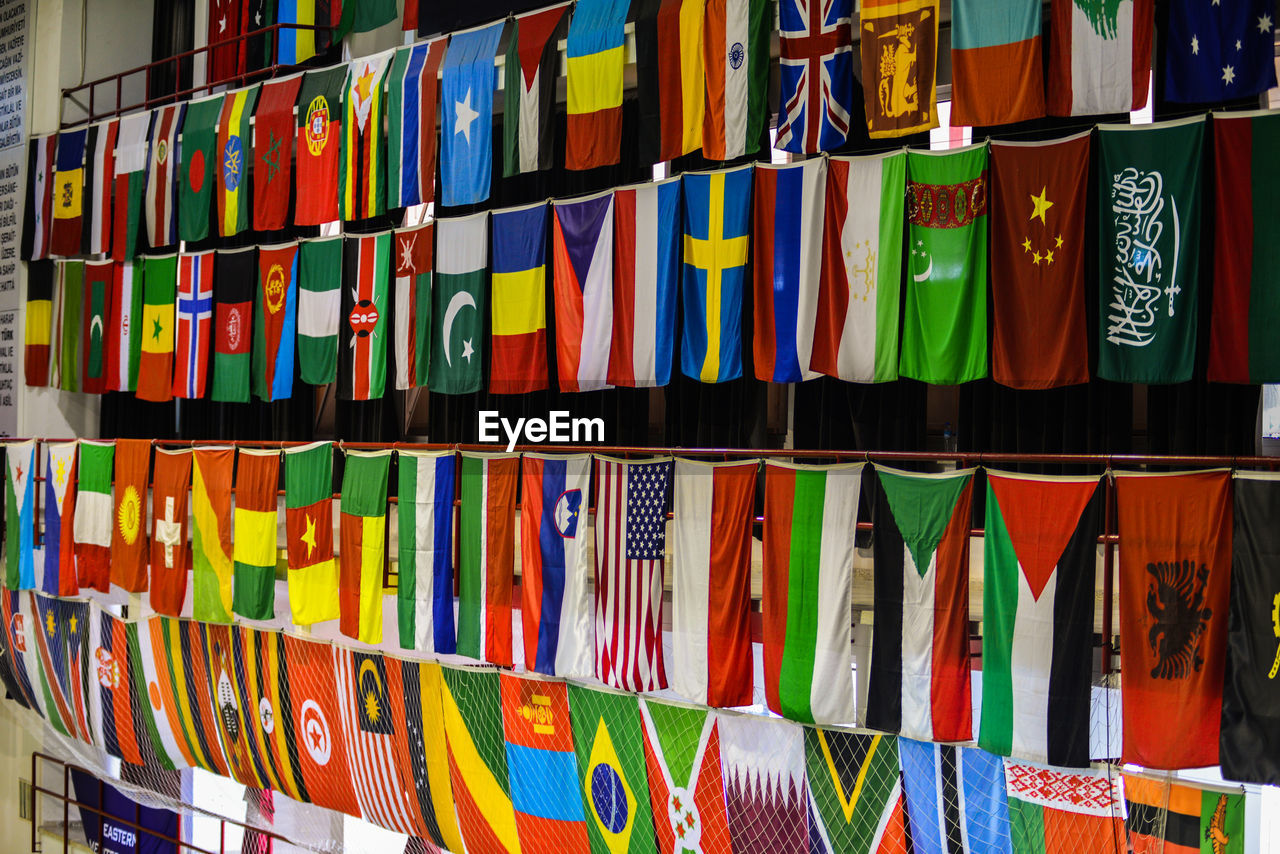 Full frame shot of multi colored flags hanging at store