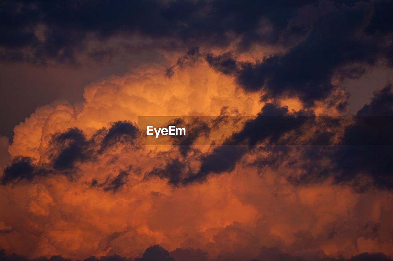 Low angle view of dramatic sky during sunset