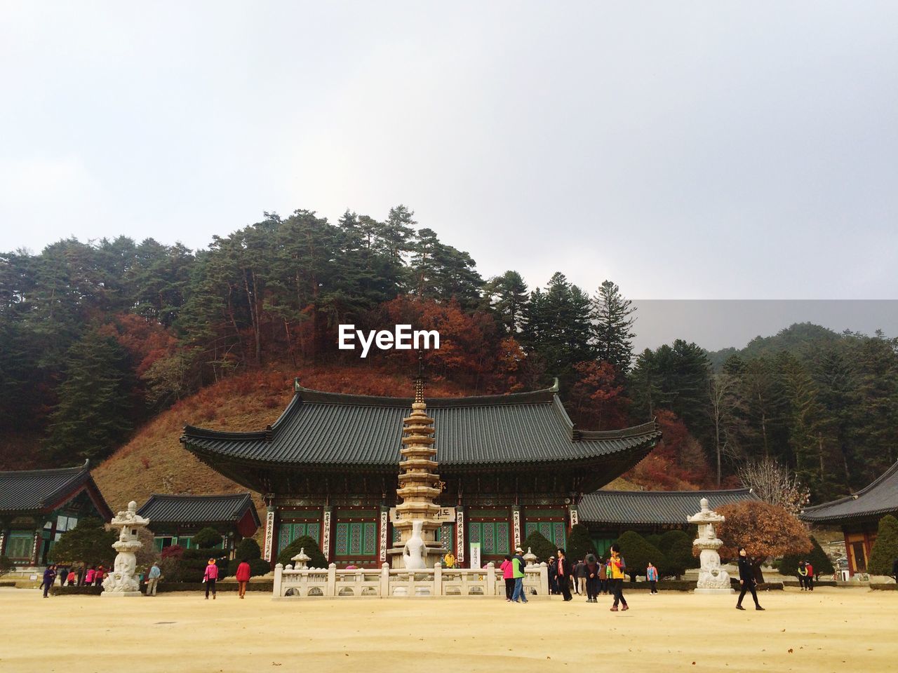 People walking by temple