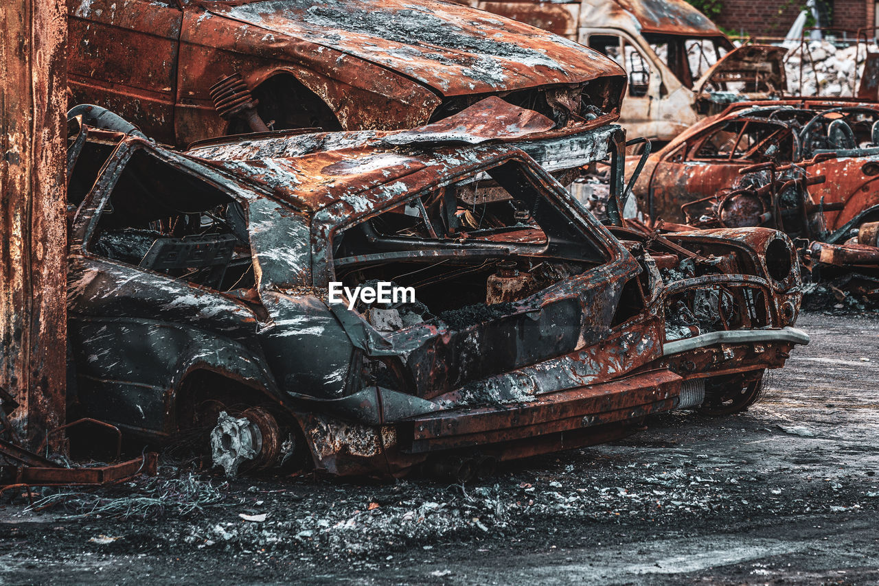 Rusted burnt out car wrecks