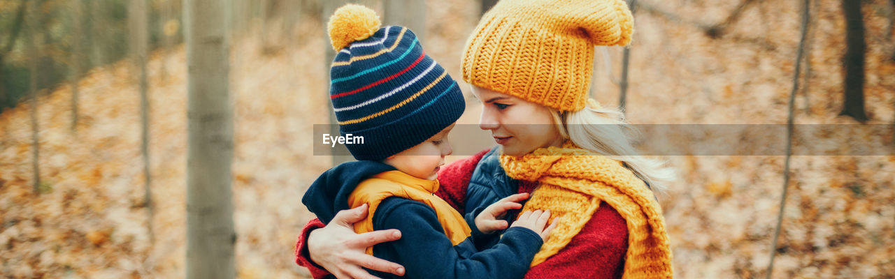 Mother and son in park during winter