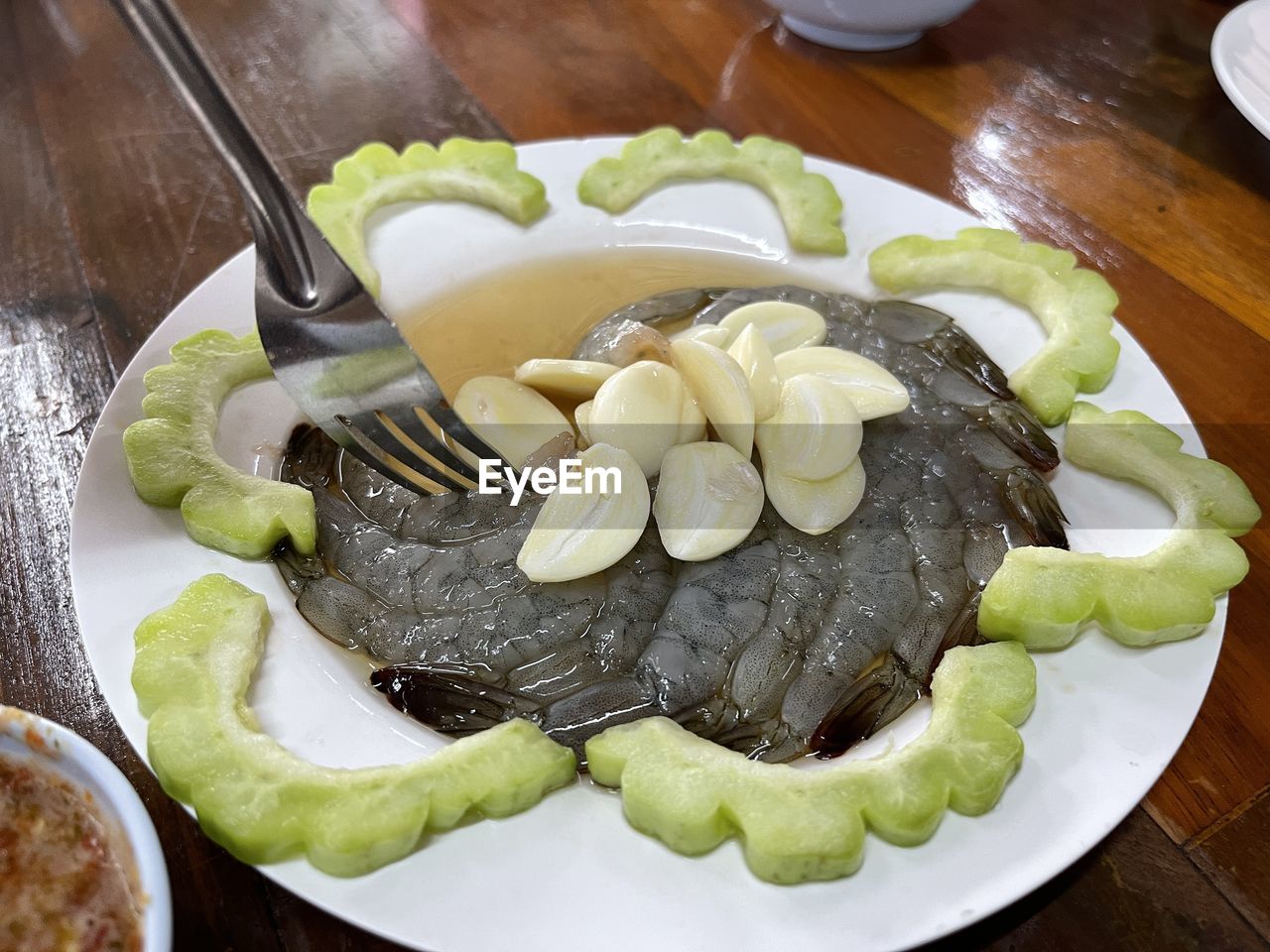 food, food and drink, healthy eating, dish, freshness, wellbeing, plate, vegetable, cuisine, meal, indoors, table, no people, produce, fruit, high angle view, wood, cucumber, still life, zucchini, slice, serving size, bowl, close-up