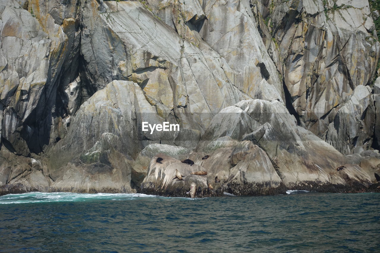 SCENIC VIEW OF SEA AND ROCK FORMATION