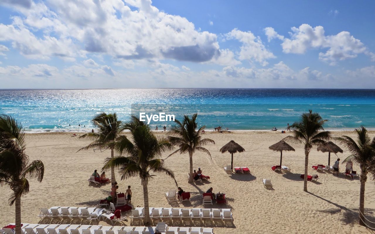 View of beach against cloudy sky