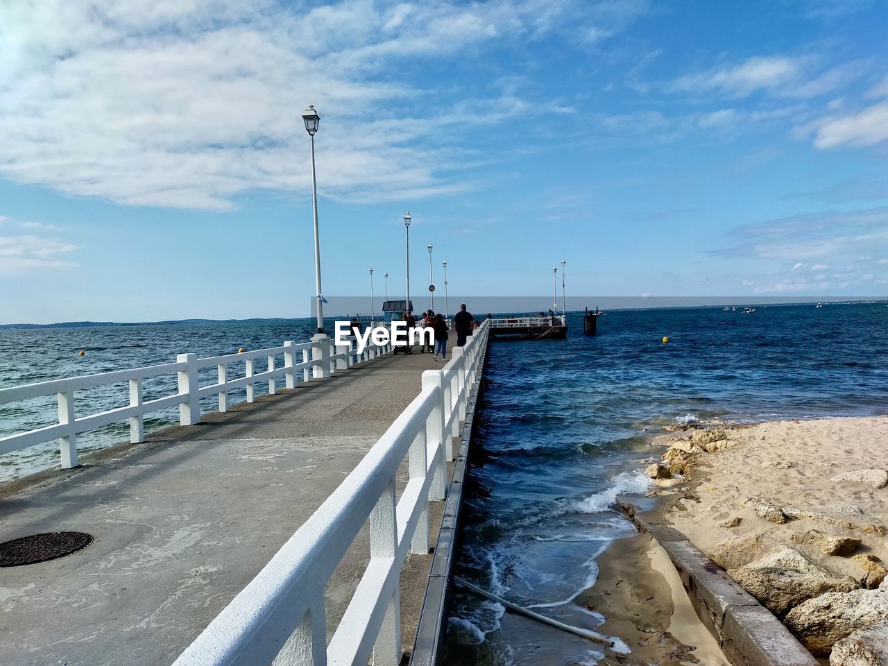 PIER OVER SEA AGAINST SKY