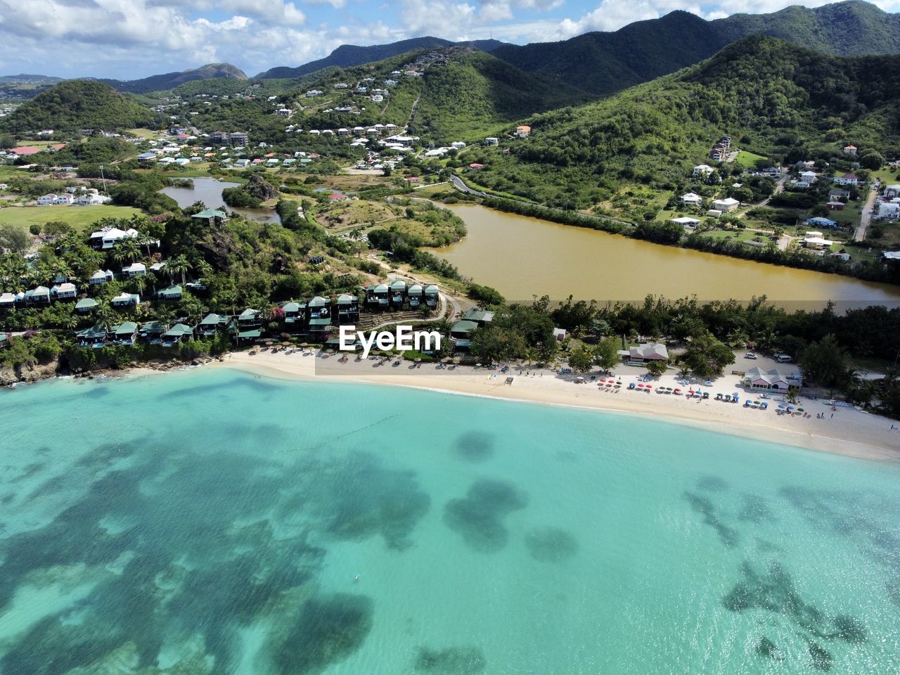 High angle view of townscape by sea