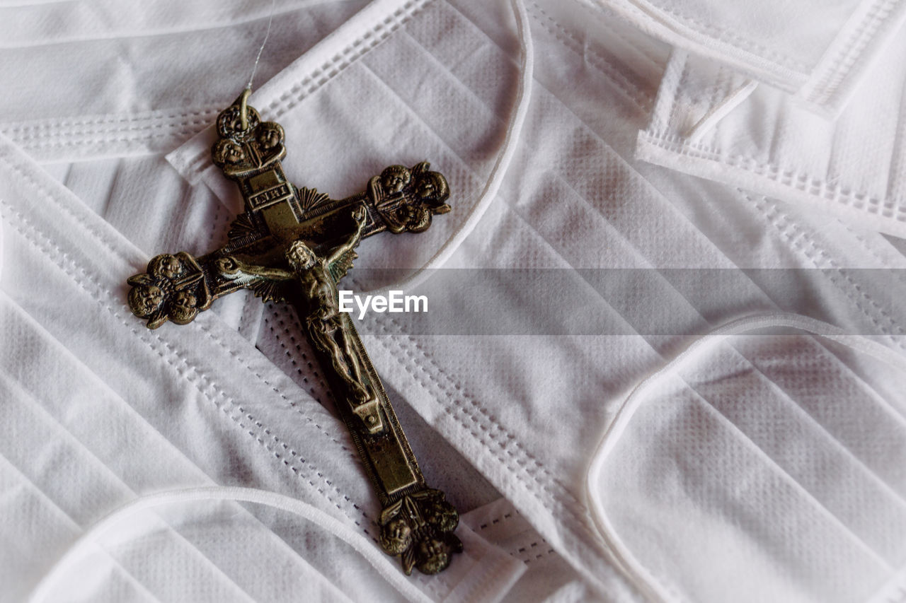 Close-up of cross on masks