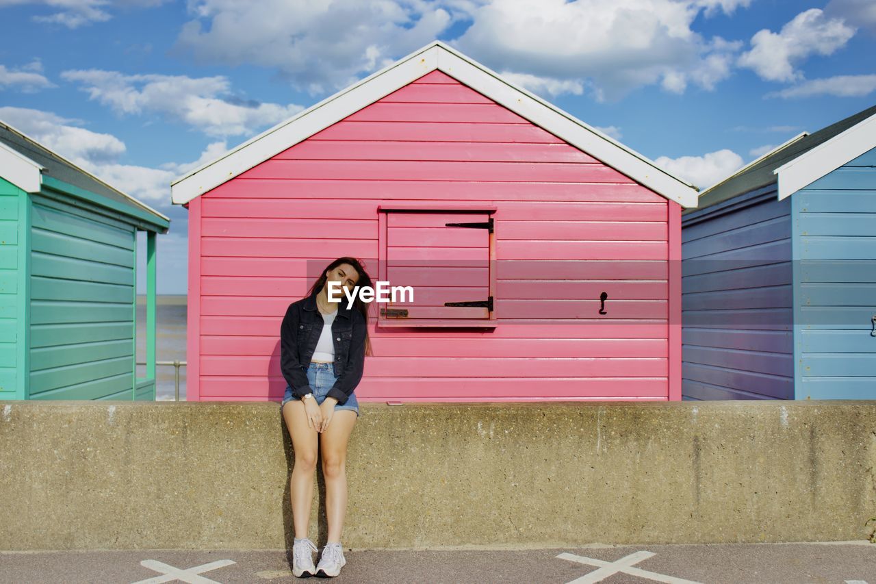 Pink beach hut with model