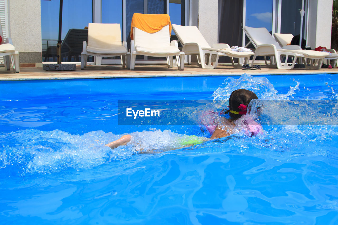 Man swimming in pool