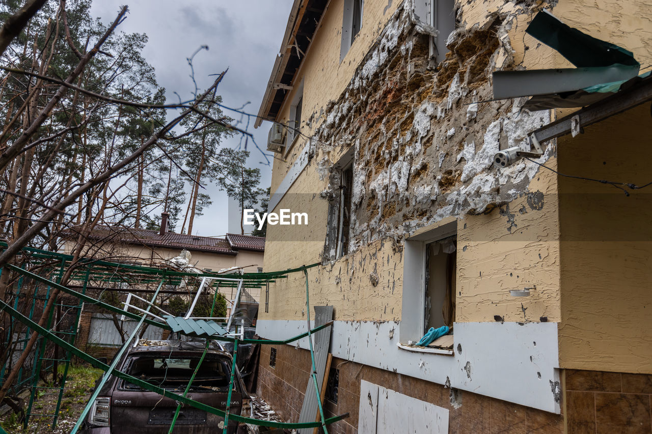 Destroyed buildings on the streets of irpen. broken windows. buildings after being hit by missiles.