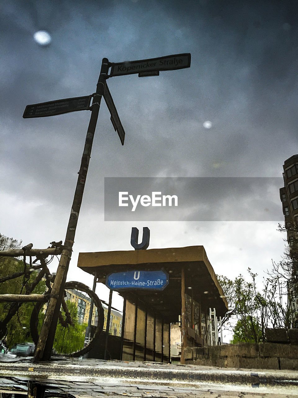 Low angle view of information sign against sky