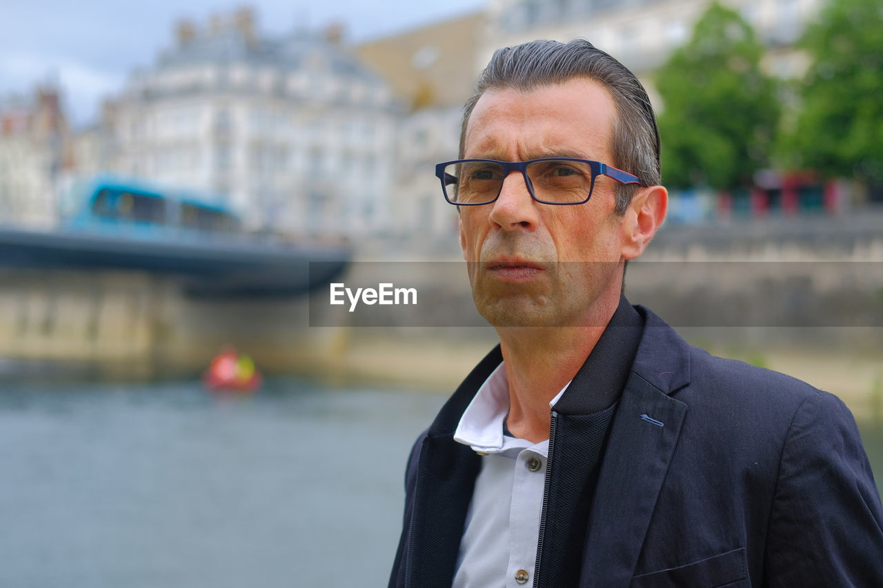 Portrait of man wearing eyeglasses