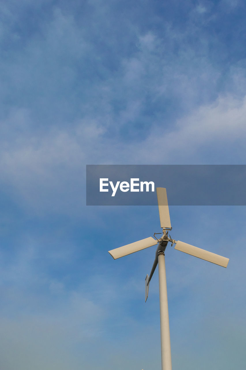 Low angle view of wind turbine against sky