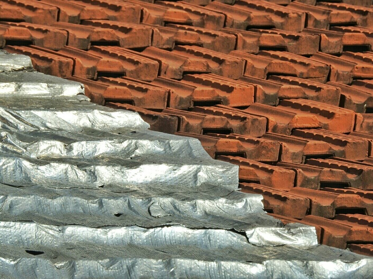 Silver covering on roof tile