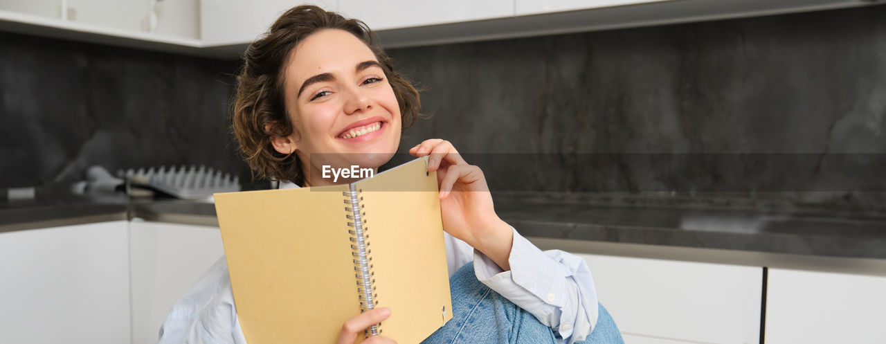 portrait of young woman using mobile phone