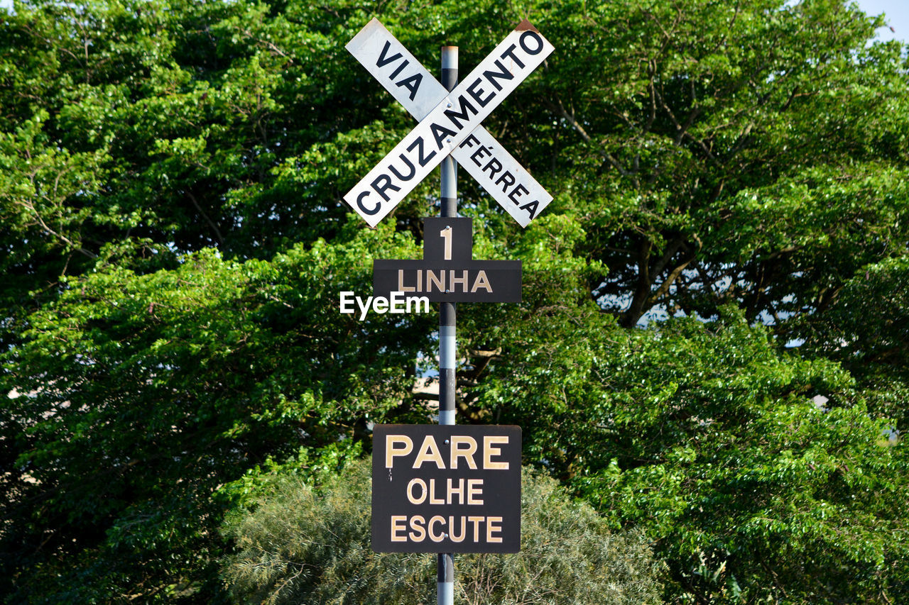 Information sign against trees