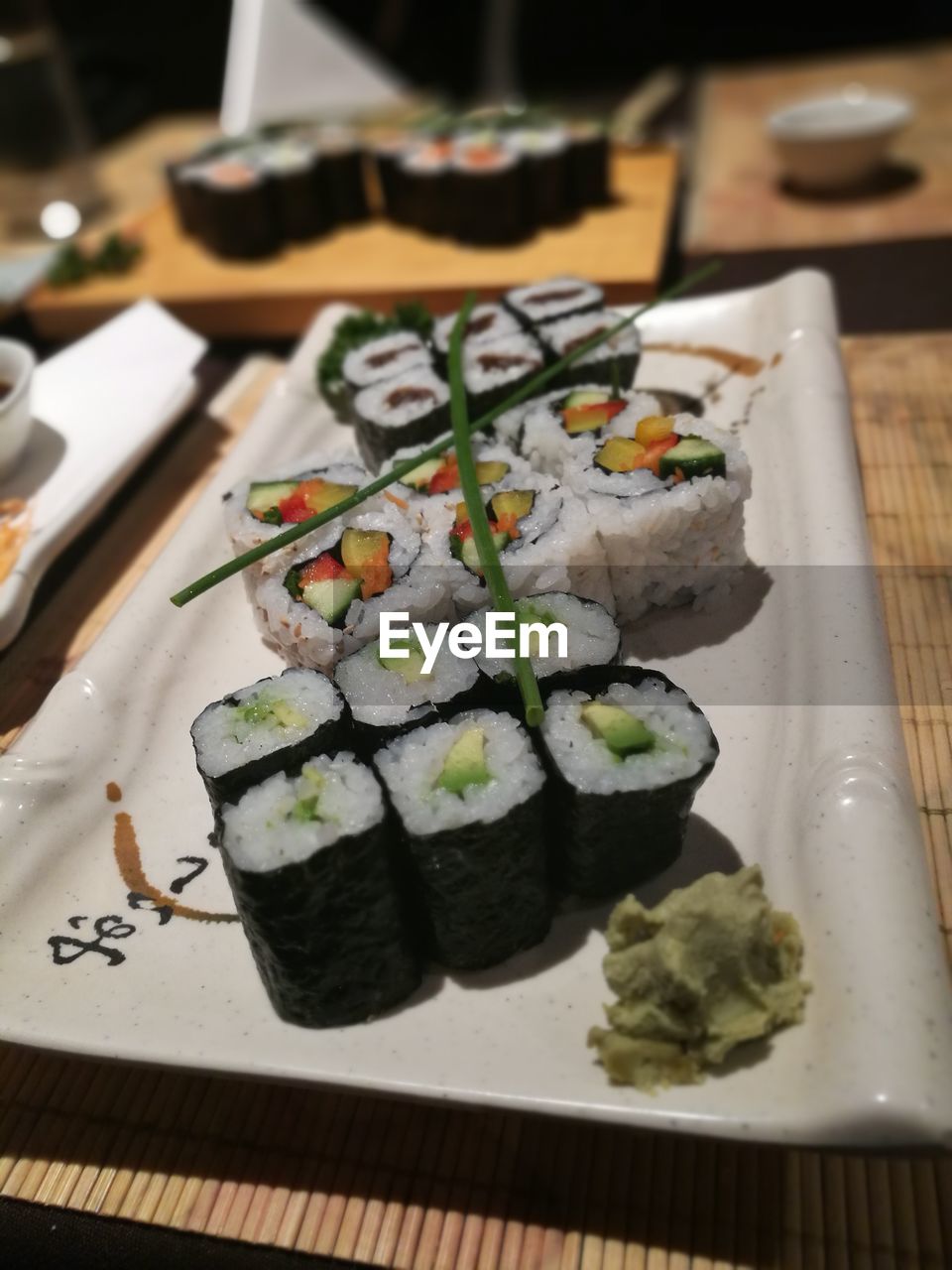 CLOSE-UP OF SUSHI SERVED IN PLATE ON TABLE