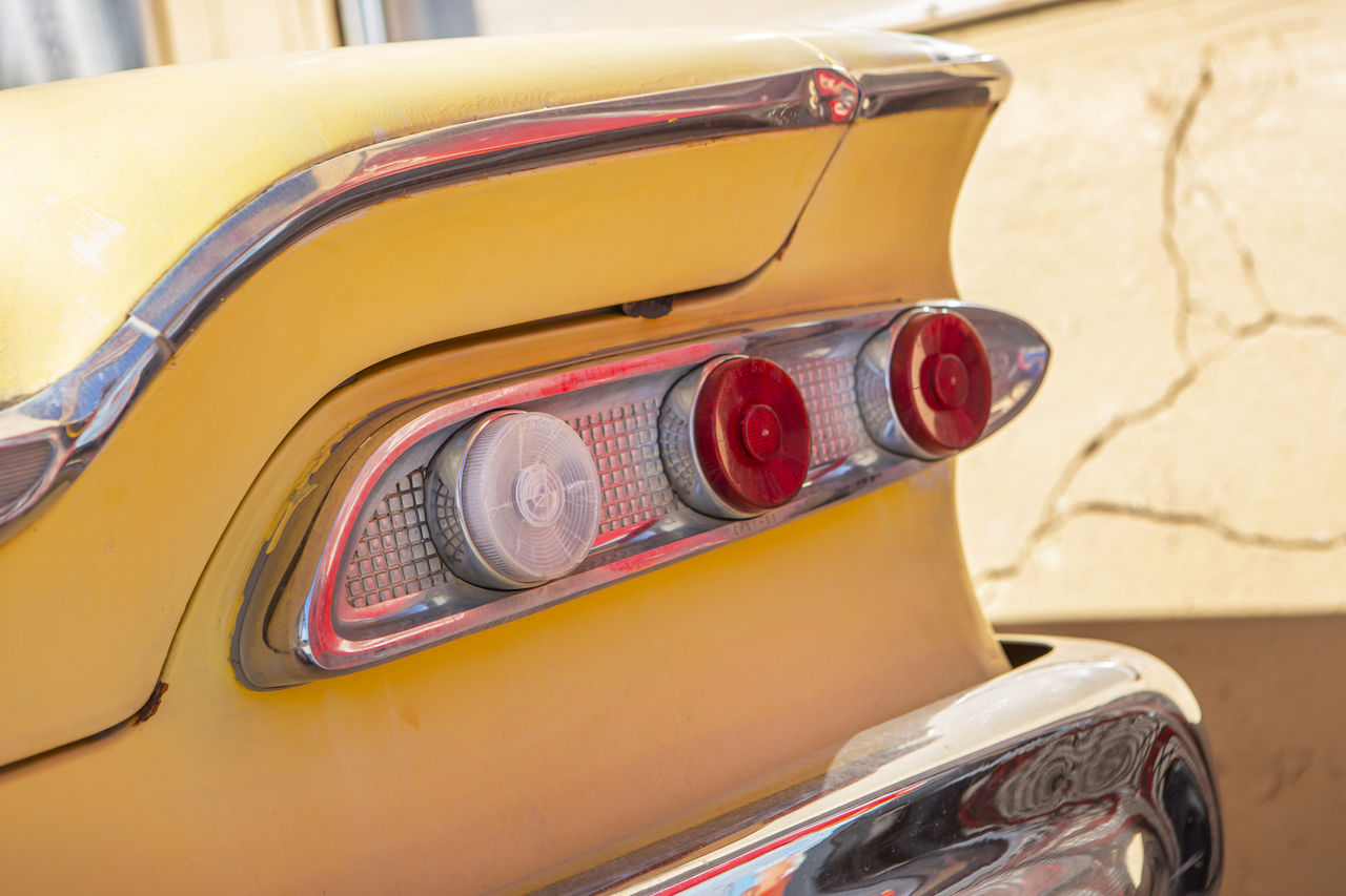 CLOSE-UP OF VINTAGE CAR ON MIRROR