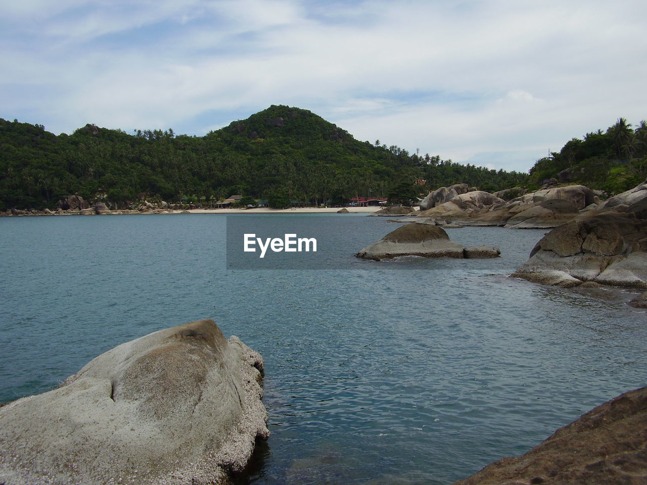 Scenic view of sea against cloudy sky