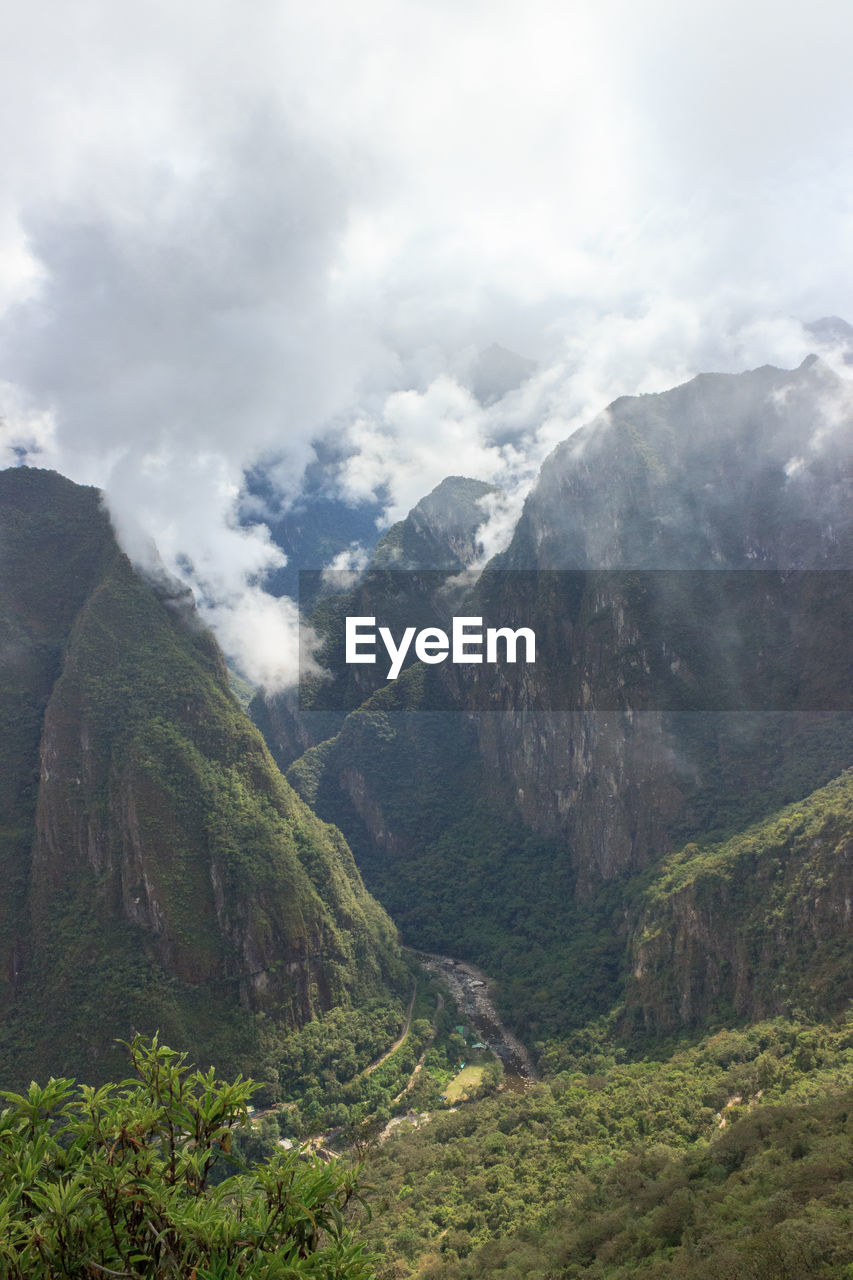 SCENIC VIEW OF VALLEY AGAINST SKY