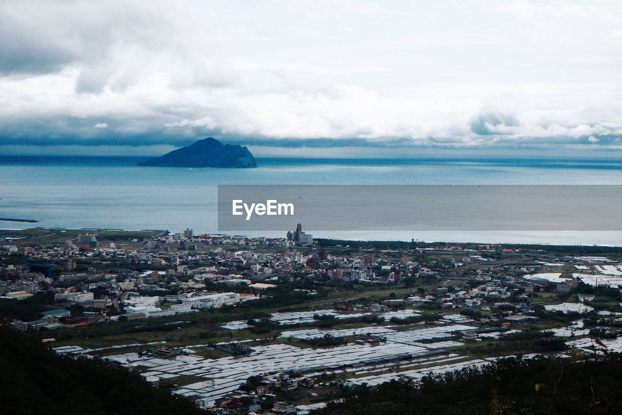 View of cityscape next to sea