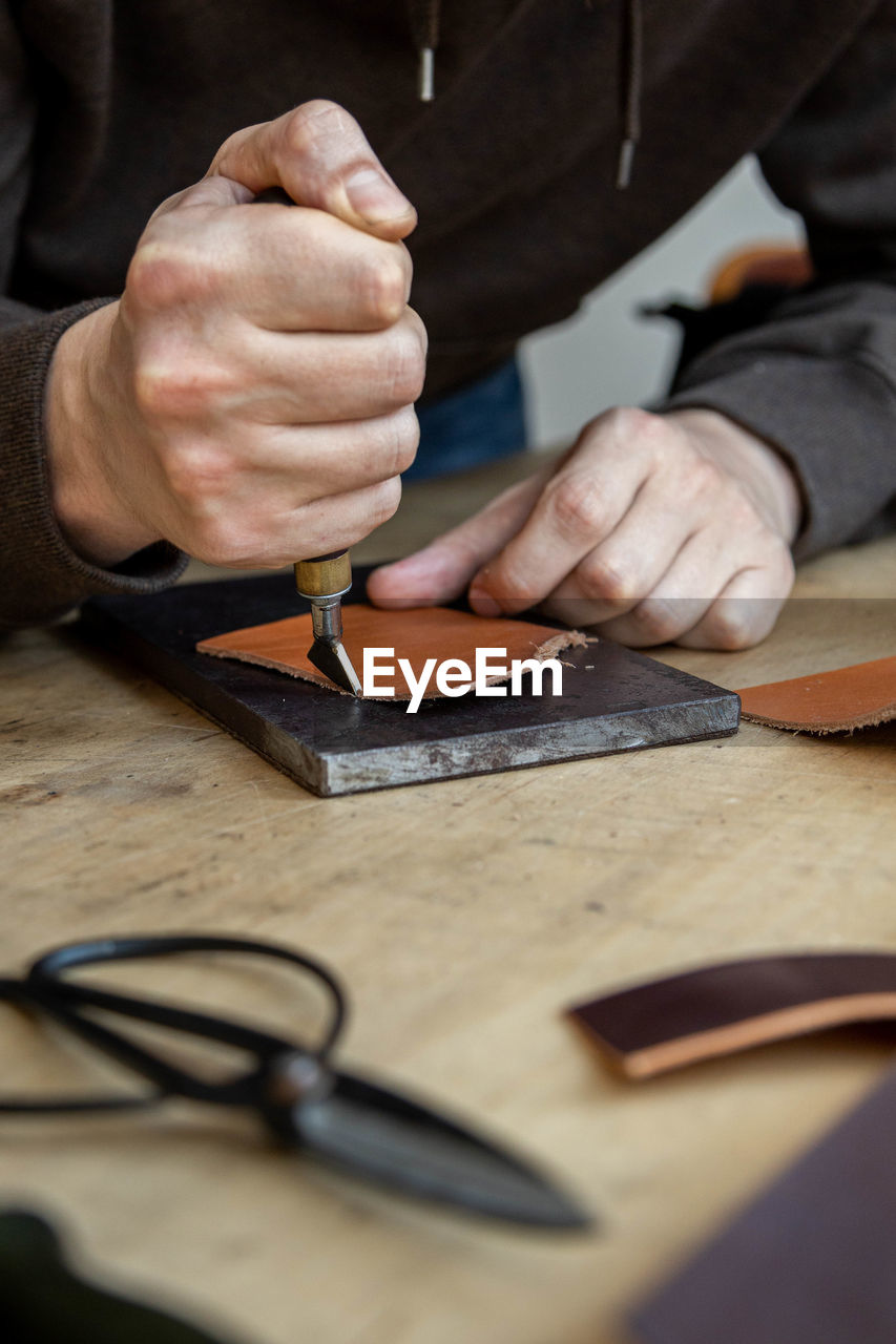 Close-up of man working on table