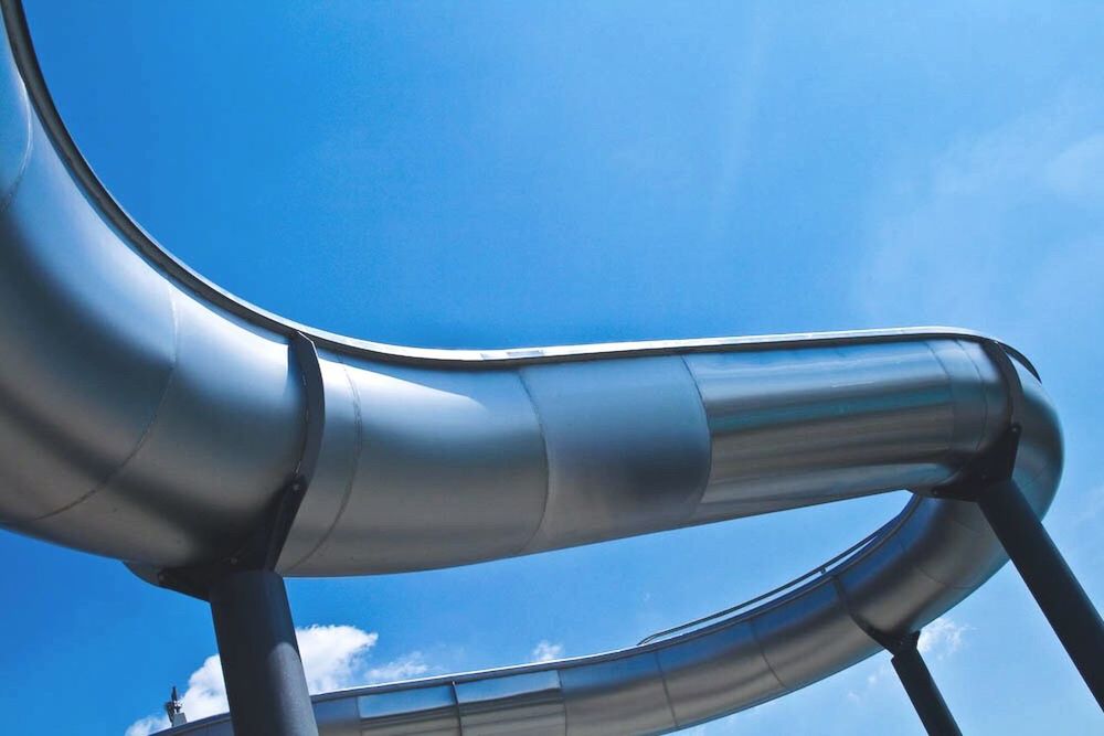 LOW ANGLE VIEW OF BUILT STRUCTURES AGAINST BLUE SKY
