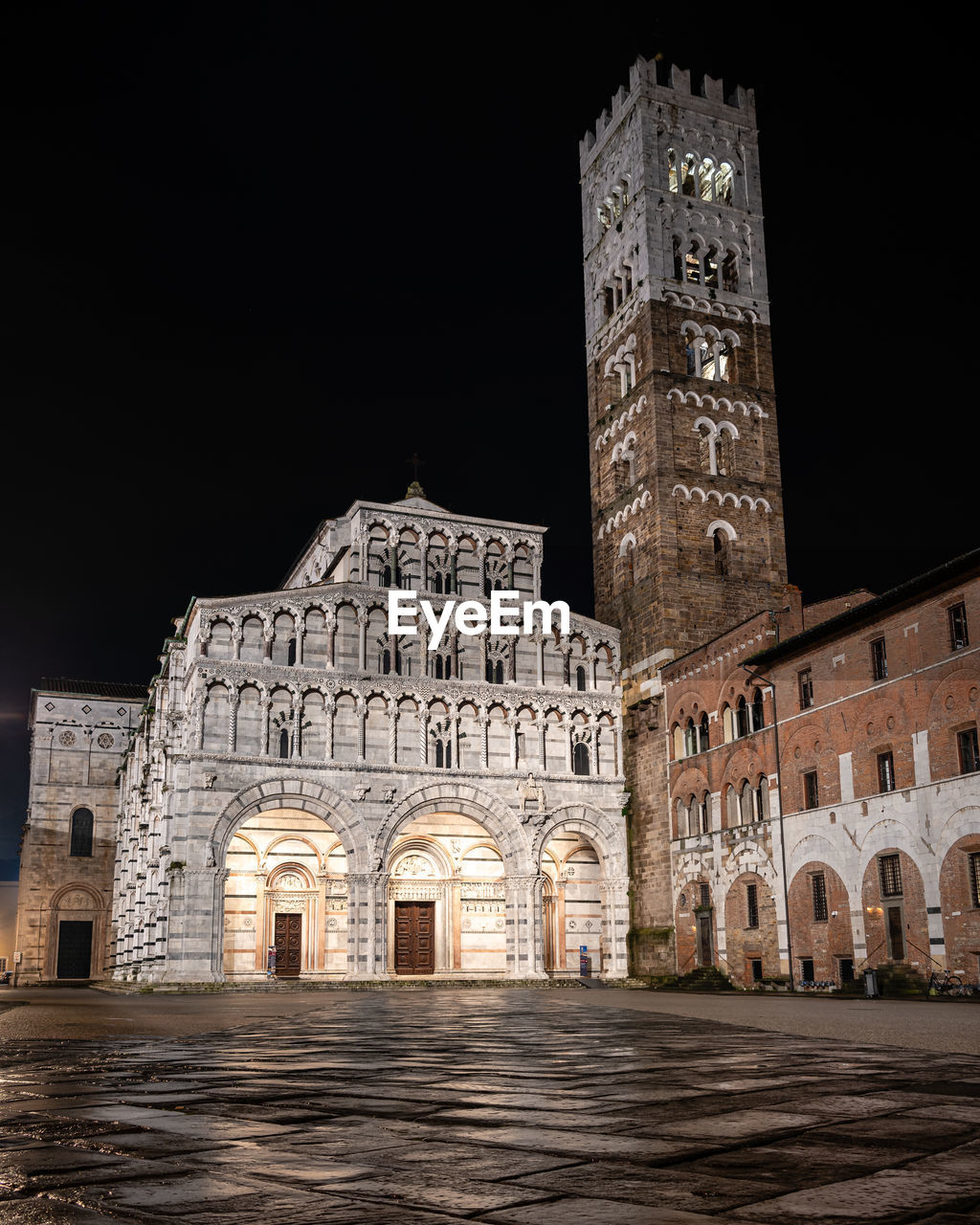 Historic buildings against clear sky at night