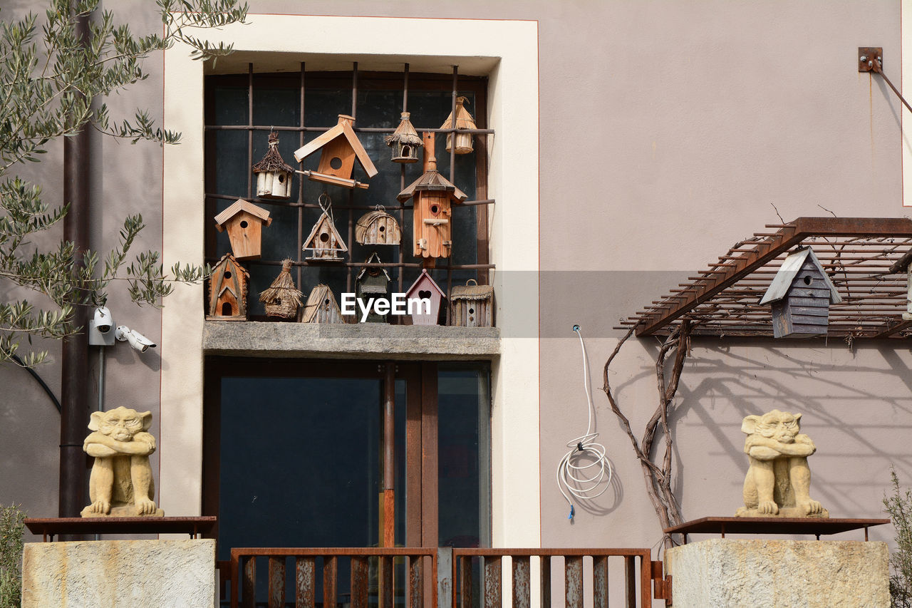 A lot of birdhouses outside a building in morcote, canton ticino, switzerland.